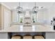 Island kitchen featuring a large center island, stainless steel appliances, and pendant lighting at 16419 Chapman Crossing Dr, Lithia, FL 33547