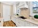 Beautiful kitchen with modern white cabinets and stainless steel gas range at 16419 Chapman Crossing Dr, Lithia, FL 33547