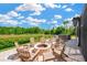 Backyard patio features a fire pit and seating with views of the water at 16419 Chapman Crossing Dr, Lithia, FL 33547