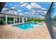 Screened in backyard pool and patio area of the home on a sunny day at 16419 Chapman Crossing Dr, Lithia, FL 33547