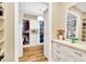 Well-organized walk-in closet with clothing racks, drawers, and open shelving, offering ample storage at 16419 Chapman Crossing Dr, Lithia, FL 33547
