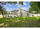 The backyard features a screened-in pool and patio, perfect for enjoying the outdoors in comfort and style at 1727 Woodpond Way, Lutz, FL 33559