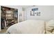 Bright bedroom with a walk-in closet featuring custom shelving for ample storage at 1727 Woodpond Way, Lutz, FL 33559