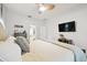 Bright bedroom with an ensuite bathroom, closet, and window overlooking the landscape at 1727 Woodpond Way, Lutz, FL 33559