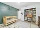 A cozy bedroom with a crib, shelving, and plenty of natural light at 1727 Woodpond Way, Lutz, FL 33559