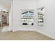 Bright bonus room with tile floors and view of the screened-in pool and lanai at 1727 Woodpond Way, Lutz, FL 33559