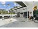 Large covered patio area with ceiling fans, tv, and comfortable seating at 1727 Woodpond Way, Lutz, FL 33559