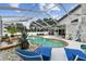 Inviting backyard pool area with a spa and a covered patio, perfect for entertaining guests at 1727 Woodpond Way, Lutz, FL 33559