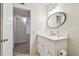 Bathroom with stylish vanity, decorative mirror and modern fixtures at 2430 Florentine Way # 46, Clearwater, FL 33763