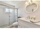 Bathroom featuring a shower, vanity, toilet, and a large mirror at 2430 Florentine Way # 46, Clearwater, FL 33763