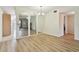 View of the dining room with wood floors and mirrored wall accents at 2430 Florentine Way # 46, Clearwater, FL 33763