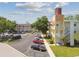 The exterior of a well maintained multi-Gathering dwelling with ample parking and attractive landscaping at 2430 Florentine Way # 46, Clearwater, FL 33763