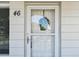 Exterior view of front door with screen door and wreath detail at 2430 Florentine Way # 46, Clearwater, FL 33763