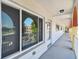 Hallway view showcases exterior with arched openings and view to parking lot at 2430 Florentine Way # 46, Clearwater, FL 33763