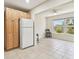 Kitchen with light wood cabinets and eat in space with large windows at 2430 Florentine Way # 46, Clearwater, FL 33763