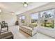 Spacious living room with large windows offering views of the well-maintained exterior landscape at 2430 Florentine Way # 46, Clearwater, FL 33763