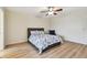 Comfortable main bedroom with vinyl flooring, ceiling fan and comfortable rocking chair at 2430 Florentine Way # 46, Clearwater, FL 33763