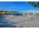 Resort-style pool area with lounge chairs and umbrellas, perfect for relaxation at 2430 Florentine Way # 46, Clearwater, FL 33763