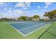 Well-maintained tennis courts with blue and green surfaces, perfect for active living at 2430 Florentine Way # 46, Clearwater, FL 33763