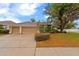 Charming home with three-car garage, mature trees, and beautiful landscaping at 2539 Centennial Falcon Dr, Valrico, FL 33596