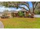 Charming single-story home boasting a well-manicured lawn and beautiful landscaping at 2539 Centennial Falcon Dr, Valrico, FL 33596