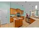 Bright kitchen with modern appliances, center island, ample storage, and tiled floor at 2539 Centennial Falcon Dr, Valrico, FL 33596