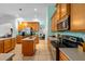 Well-equipped kitchen featuring an island, stainless steel appliances, and tile flooring at 2539 Centennial Falcon Dr, Valrico, FL 33596