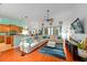 Open-concept living room with a comfortable sectional couch and a view to the kitchen at 2539 Centennial Falcon Dr, Valrico, FL 33596