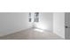 Bright bedroom with tile floors and natural light from double windows at 27148 Capri Shores Cir, Englewood, FL 34223