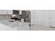 Modern kitchen features stainless steel appliances, white cabinets, and tile backsplash at 27148 Capri Shores Cir, Englewood, FL 34223