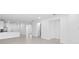 Open concept living room with neutral walls and tiled floor at 27148 Capri Shores Cir, Englewood, FL 34223