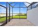 Enjoy serene lake views from the comfort of this property's screened lanai at 27148 Capri Shores Cir, Englewood, FL 34223