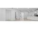 Open-concept living space featuring neutral walls, tile flooring, and lots of natural light from the kitchen at 27152 Capri Shores Cir, Englewood, FL 34223
