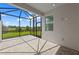 Enclosed patio features brick pavers, ideal for entertaining and outdoor enjoyment at 27152 Capri Shores Cir, Englewood, FL 34223