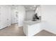 A clean, bright kitchen with white cabinets and stainless steel appliances is ready for cooking at 27156 Capri Shores Cir, Englewood, FL 34223