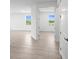 Open-concept living space boasting tile floors, natural lighting, and access to multiple rooms at 27156 Capri Shores Cir, Englewood, FL 34223