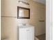 Bathroom featuring tiled walls, a vanity, a mirror, and a walk-in shower at 2916 E North St, Tampa, FL 33610