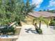An aerial view shows the home's tile roof, two-car garage, manicured landscaping, and driveway at 305 Bluewater Falls Ct, Apollo Beach, FL 33572