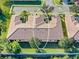 Drone shot highlighting the roof and surrounding trees at 305 Bluewater Falls Ct, Apollo Beach, FL 33572