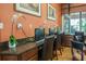 Computer room with multiple computers and chairs near a window with a view at 305 Bluewater Falls Ct, Apollo Beach, FL 33572