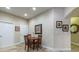 Cozy dining area with neutral flooring and walls, perfect for enjoying intimate meals and Gathering gatherings at 305 Bluewater Falls Ct, Apollo Beach, FL 33572