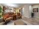Bright living room featuring decorative armchairs, elegant lighting, and neutral color palette at 305 Bluewater Falls Ct, Apollo Beach, FL 33572