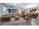 A comfortable living room with neutral decor offers a harmonious space for relaxation and socializing at 305 Bluewater Falls Ct, Apollo Beach, FL 33572