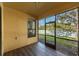 Screened patio offers outdoor living space, providing views of backyard at 305 Bluewater Falls Ct, Apollo Beach, FL 33572