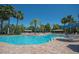 Gorgeous community pool with ample seating and shade, creating an ideal space for recreation and leisure at 305 Bluewater Falls Ct, Apollo Beach, FL 33572