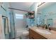Bathroom featuring a shower-tub, granite vanity and nautical decorations at 3066 19Th Sw Pl, Largo, FL 33774