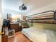 Bedroom featuring bunk beds, wood laminate flooring and ceiling fan at 3066 19Th Sw Pl, Largo, FL 33774