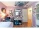 Cozy bedroom with desk, wall art, and ample closet and storage space at 3066 19Th Sw Pl, Largo, FL 33774