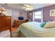 Relaxing bedroom with wood floors, a window, and ample furniture at 3066 19Th Sw Pl, Largo, FL 33774