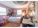 Charming bedroom with hardwood floors, whimsical decor, and artistic accents at 3066 19Th Sw Pl, Largo, FL 33774